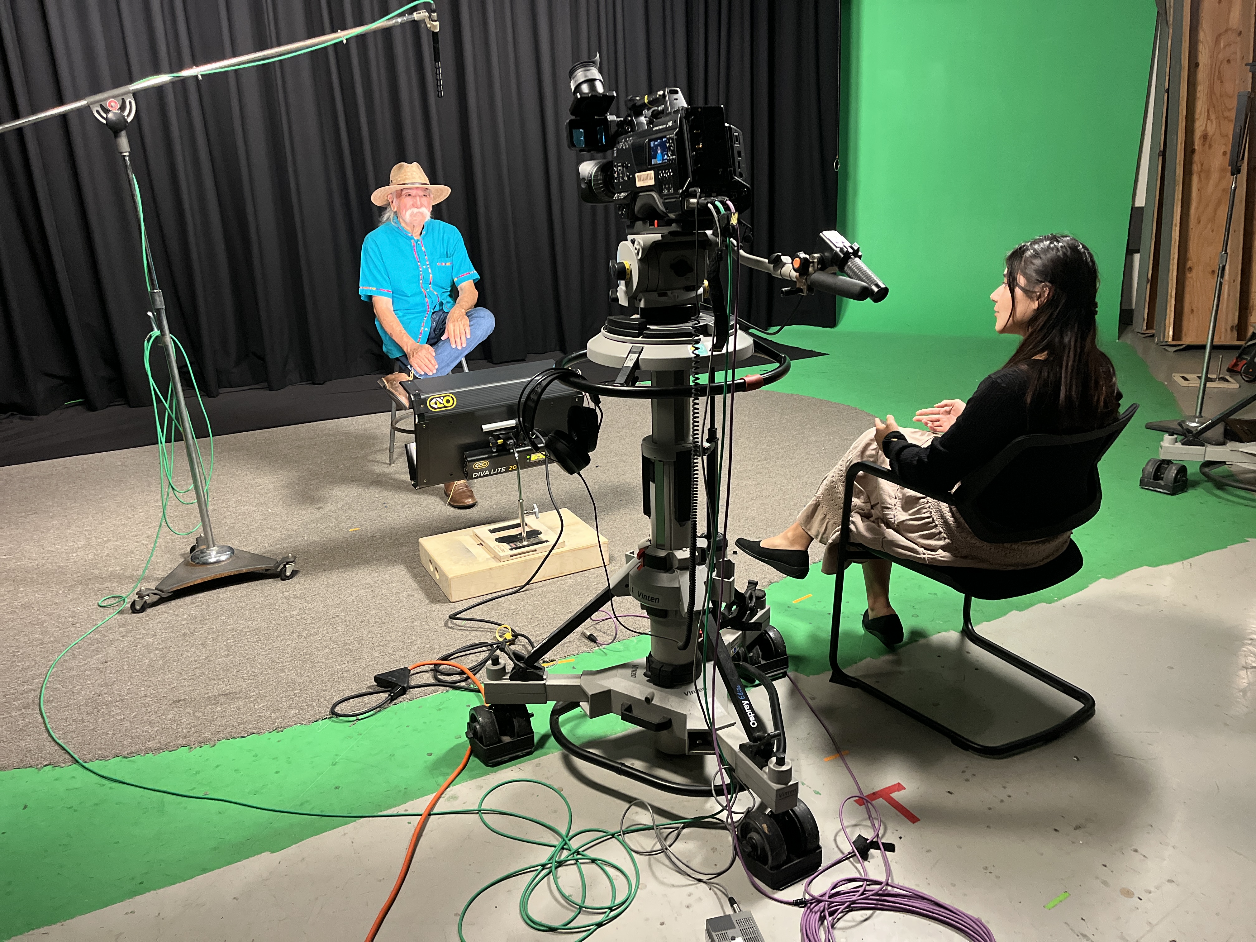 Activist and author, Víctor González, pictured alongside PhD Student and Project Coordinator, Mayra Gomez-Labrada, at UCSB's Instructional Development Studio.