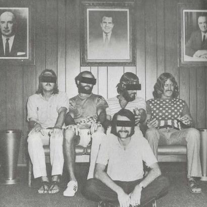 FBI agents active in Isla Vista posing for a photo in the Los Angeles FBI office under portraits of Attorney General John Mitchell, Richard Nixon, and J. Edgar Hoover